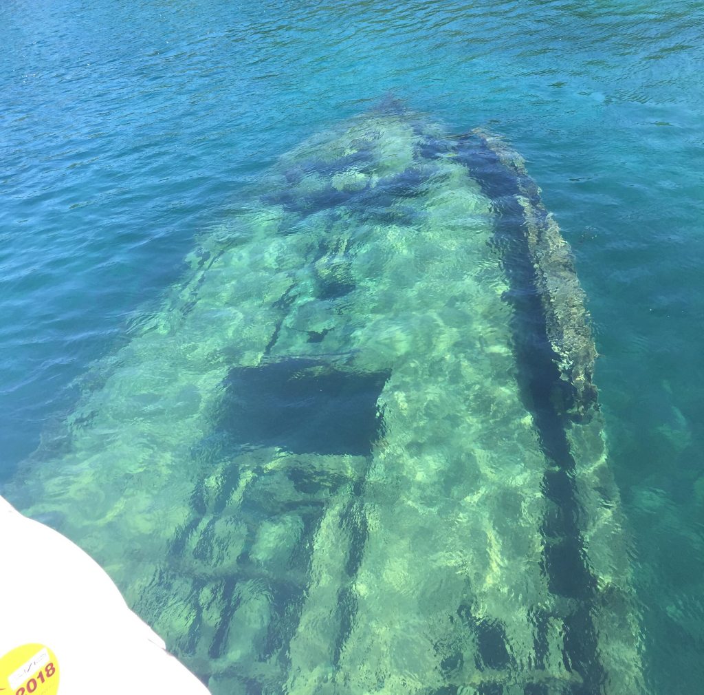 the bow of a submerged wooden schooner.