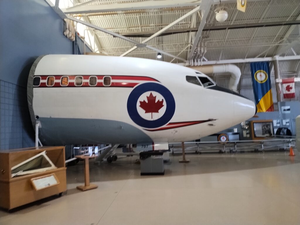 the front section of an aircraft coming out of a wall